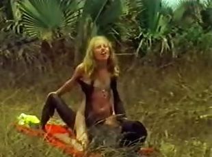 Blonde hottie takes a ride on a BBC outdoors. Hot vintage clip