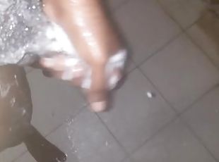 African teen mastrubating in the shower with his big cock