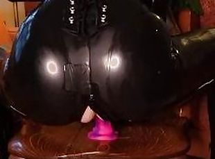 Katya Kova rides her dildo in a latex catsuit, corset, and gloves