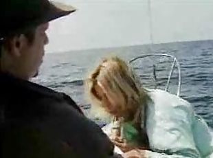 Babe on a boat sucking a hot cock