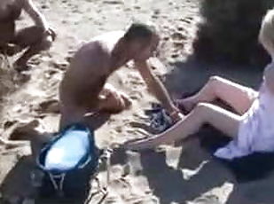 Voyeur masturbates on the beach