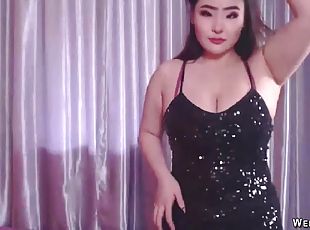 Busty Asian babe stripping and sucking dildo in private show