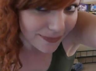 Redhead beauty strips and dances in front of a webcam