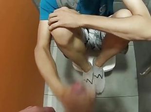 Jerking off on my friend's ass in a public toilet