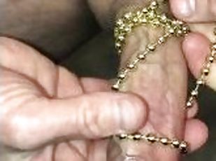 Watch me use a beaded necklace to stimulate my cock while I masturbate and cum
