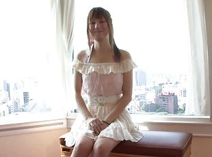 Japanese tranny in a Parisian hotel room stroking her cock